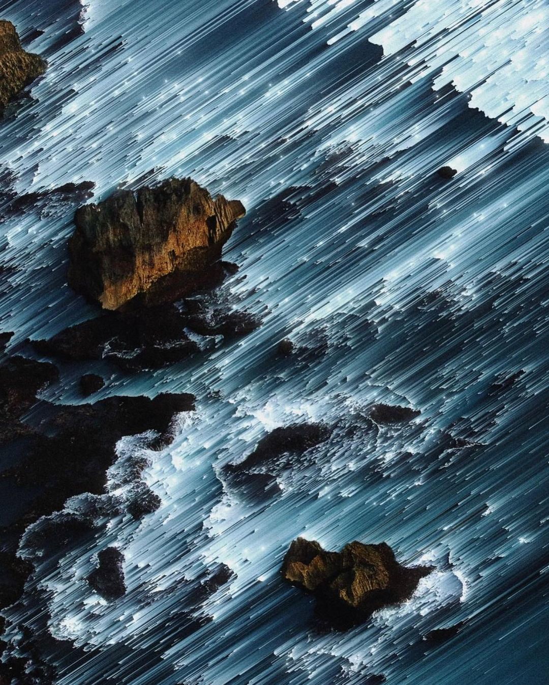 a couple of rocks that are in the water