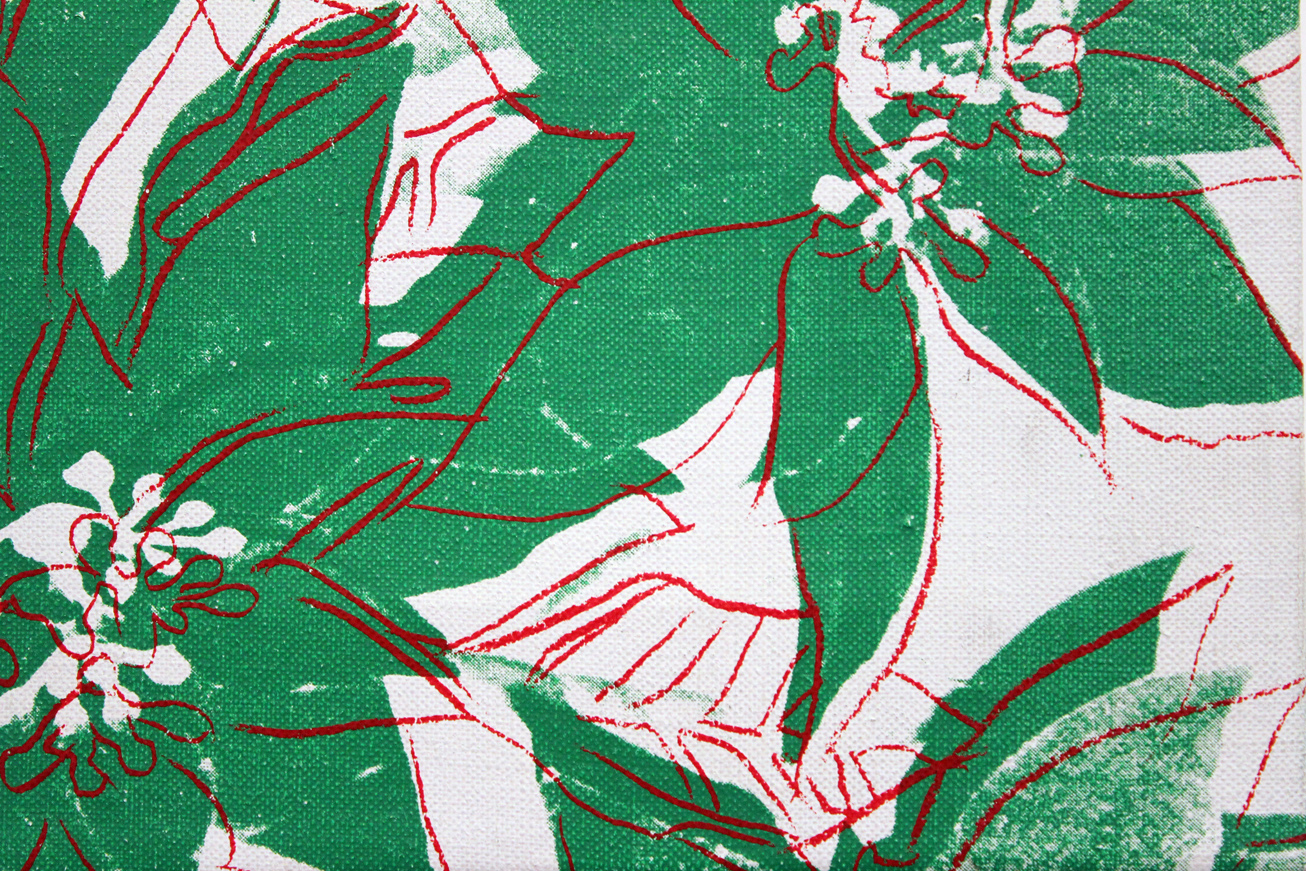 a close up of a green and white flowered fabric