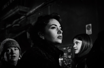 a black and white photo of three women