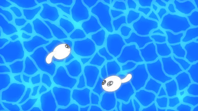 a couple of white fish floating on top of a blue pool