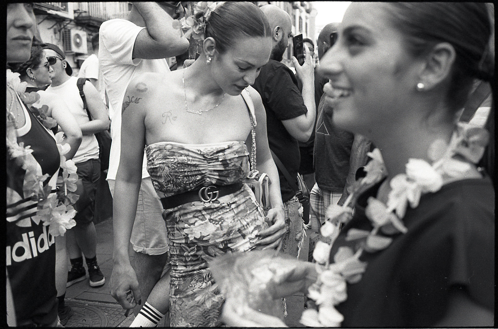 a black and white photo of a woman in a dress