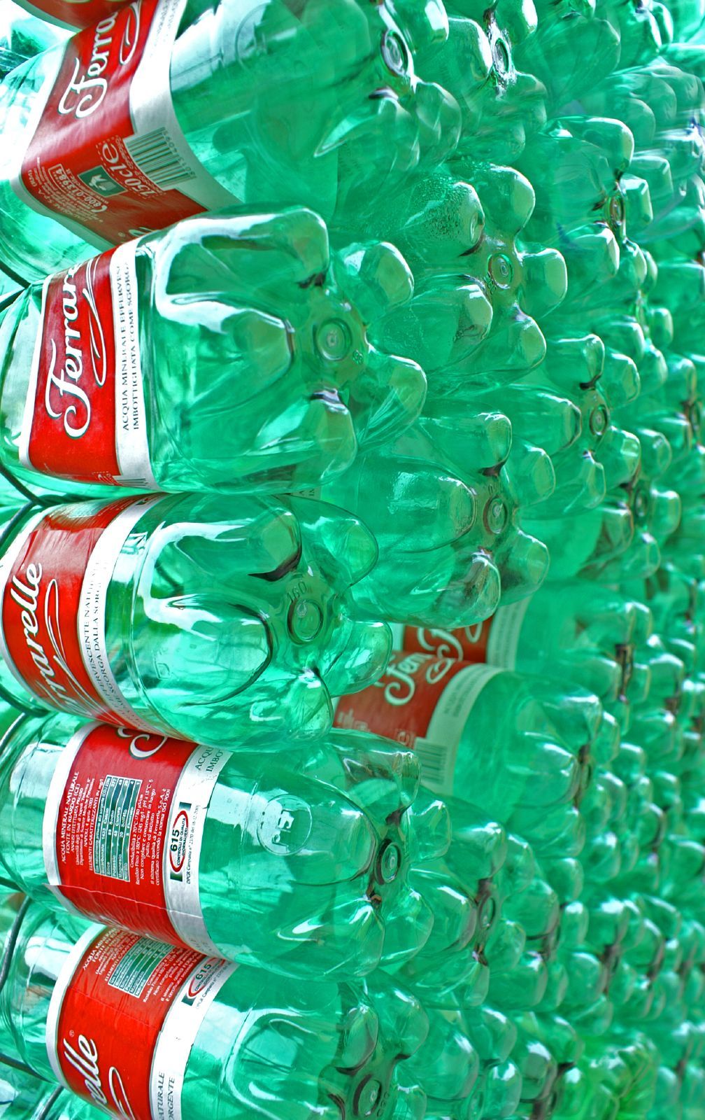 a bunch of soda bottles stacked on top of each other