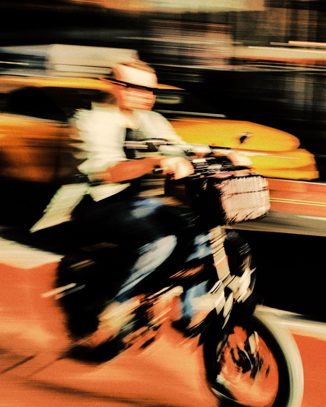 a man riding a motorcycle down a street