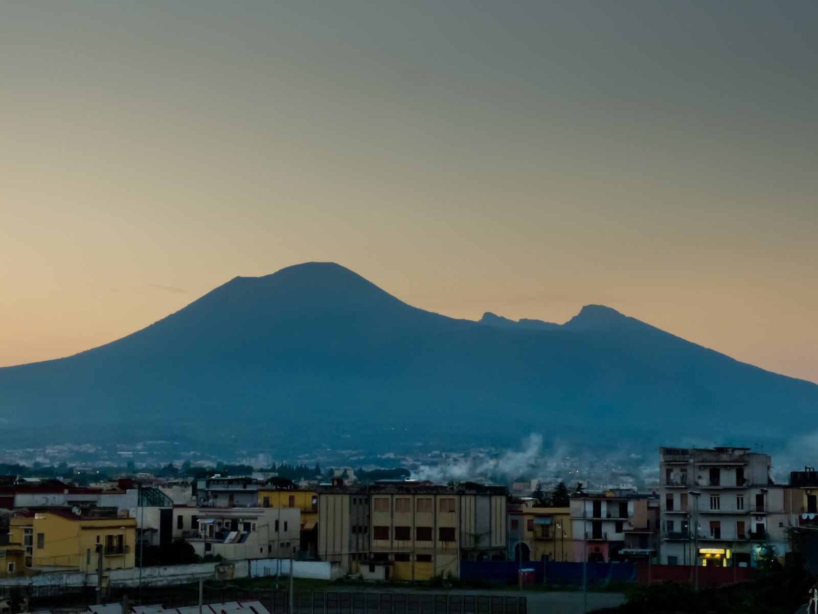 a view of a city with a mountain in the background