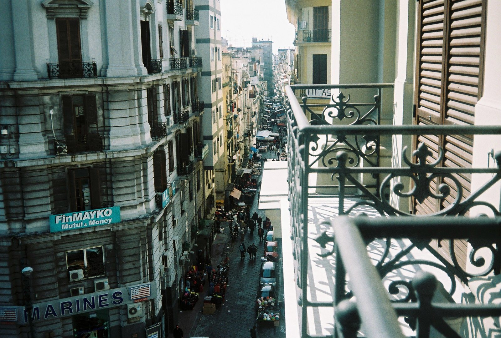 a view of a city street from a balcony