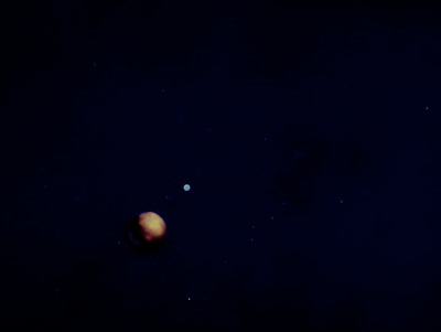 an image of two planets in the sky