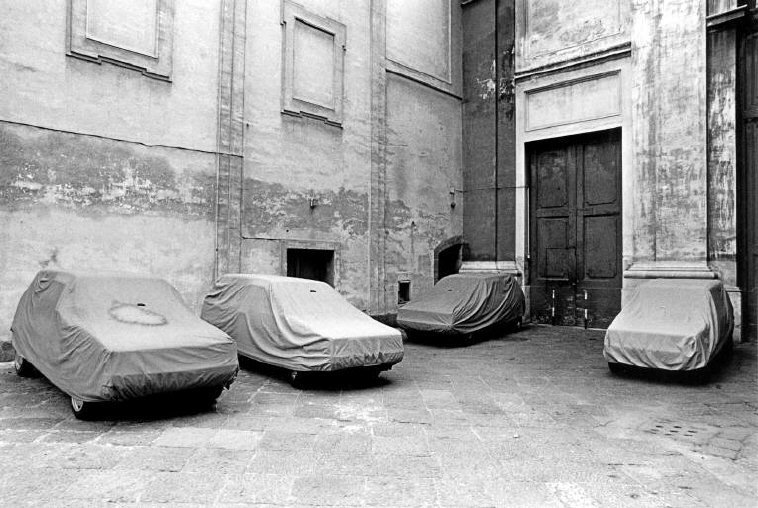 a black and white photo of a bunch of beds