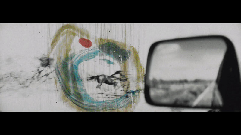 a side view mirror sitting on the side of a wall