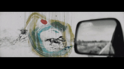 a side view mirror sitting on the side of a wall