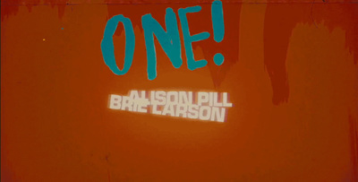 a sign that says one on a red wall