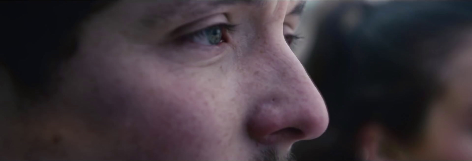 a close up of a person's face with a blurry background