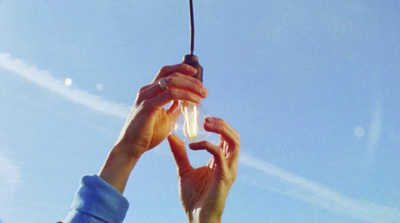 a group of people reaching up into the air