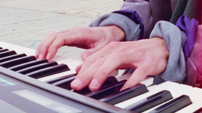 a close up of a person playing a keyboard