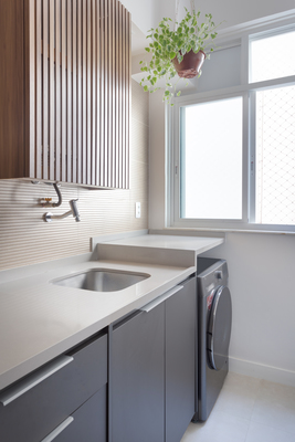 a kitchen with a washer and a window