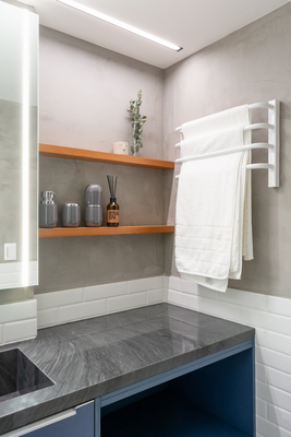 a bathroom with a sink and a towel rack