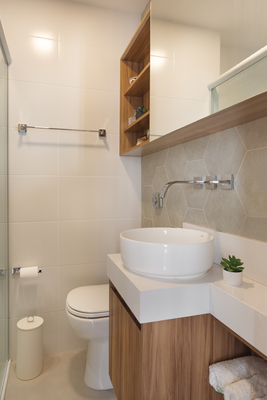 a bathroom with a sink, toilet, and shower