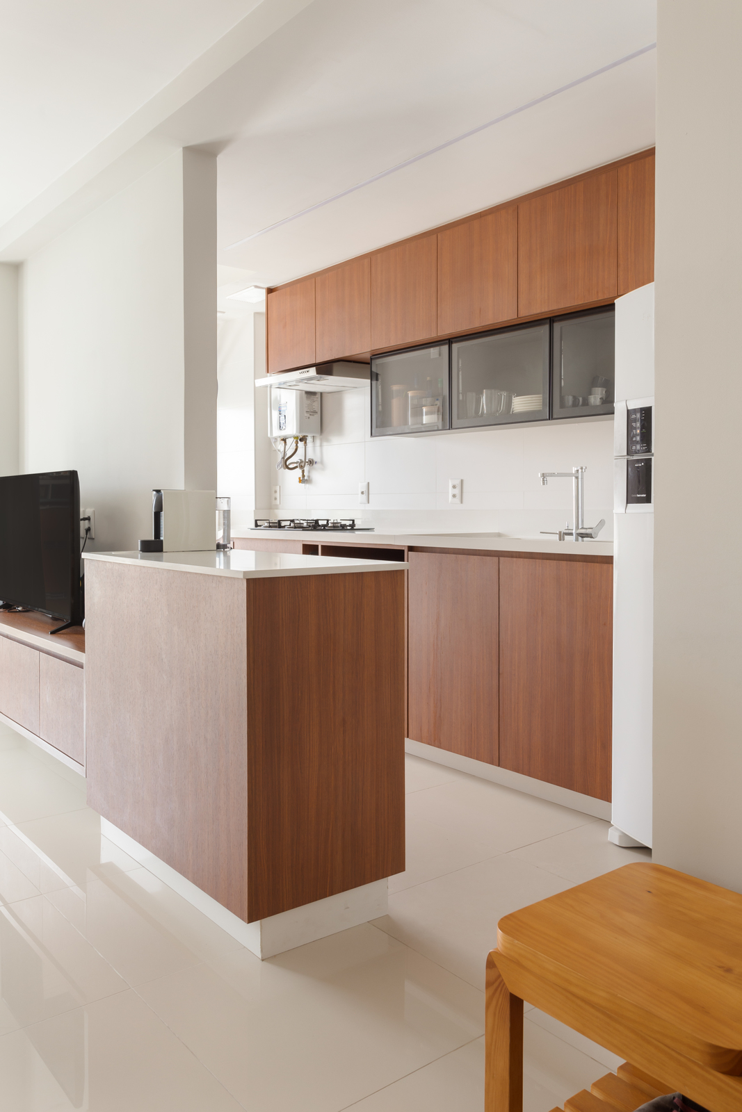 a kitchen with a large center island in the middle of the room