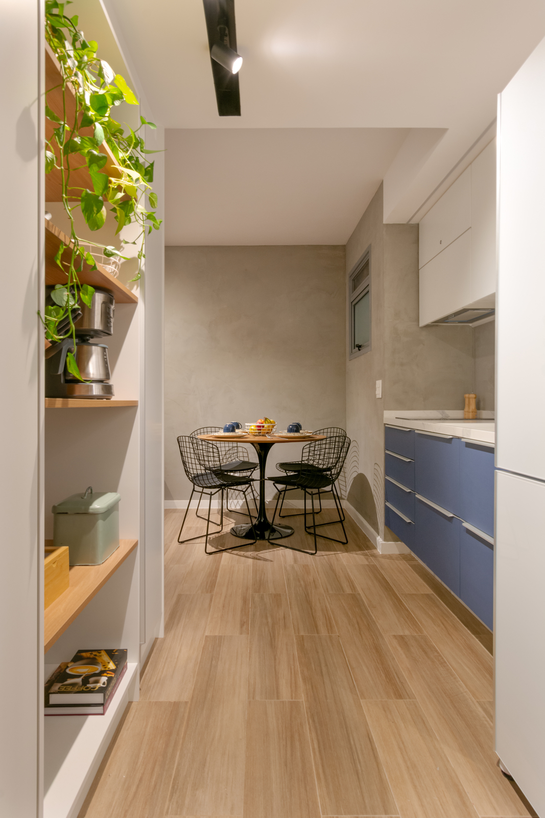 a kitchen with a table and chairs in it