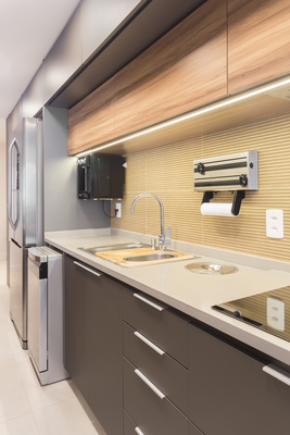 a kitchen with a sink a refrigerator and a dishwasher