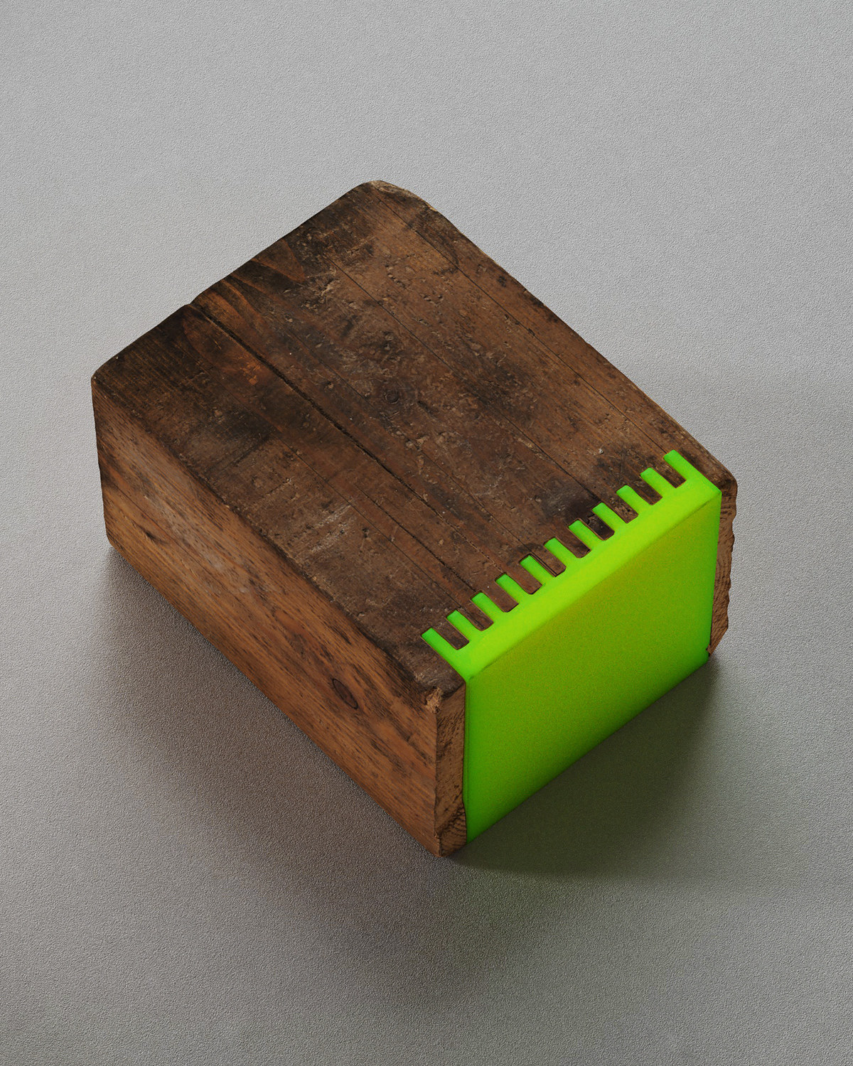 a piece of wood with a green handle on it