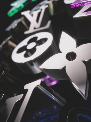 a close up of a clock with a flower on it