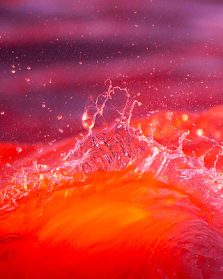 a close up of a red and orange wave