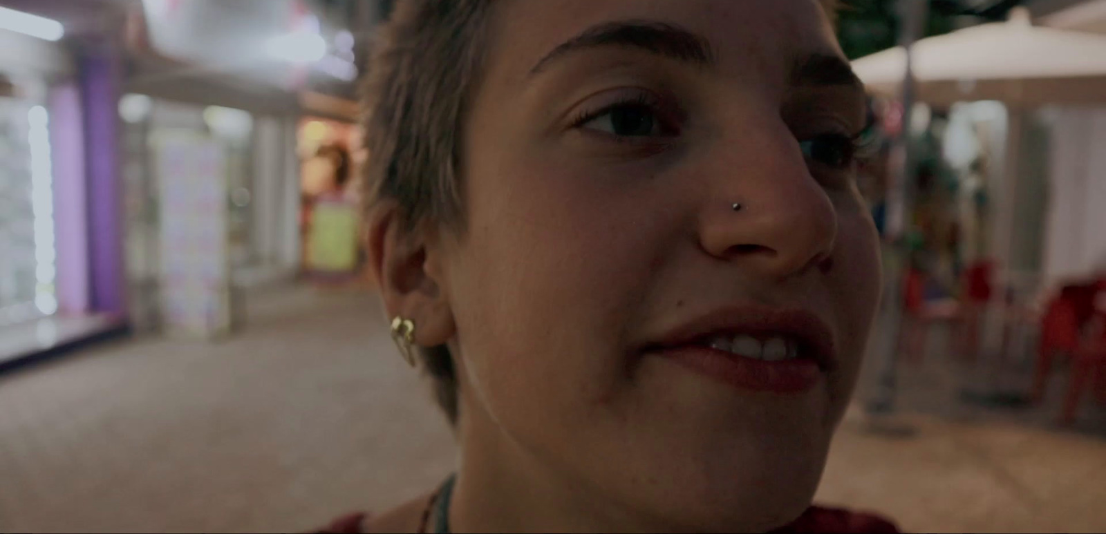 a close up of a person wearing a necklace