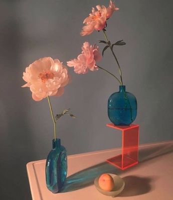 a couple of vases that are sitting on a table