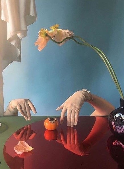 a painting of a person reaching for a flower