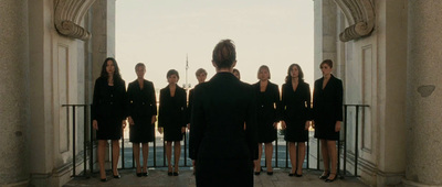 a group of women standing in front of a doorway