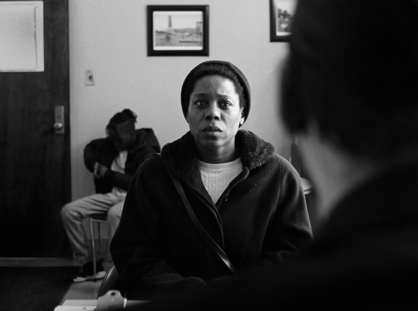 a black and white photo of a person in a room