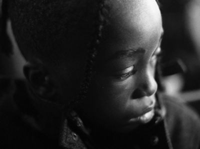 a young child with braids on her head