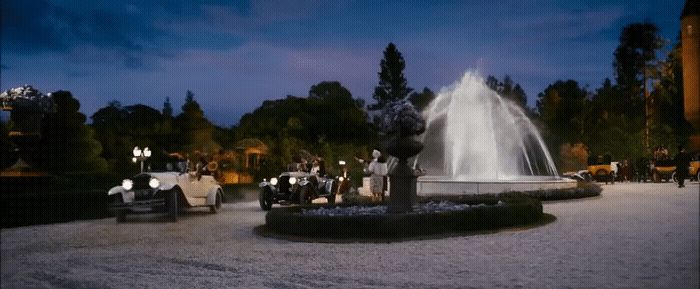 a group of people standing around a fountain