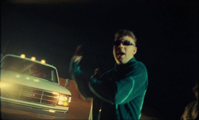 a man standing in front of a white truck