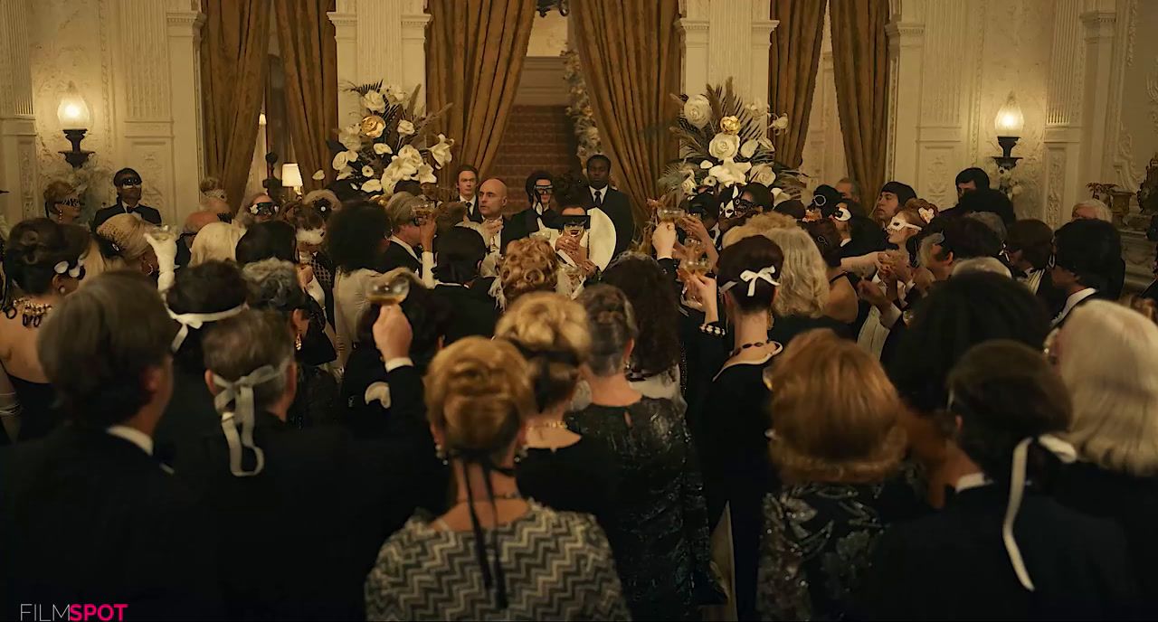 a large group of people standing in a room