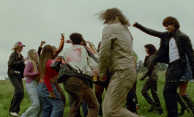 a group of people standing in a field