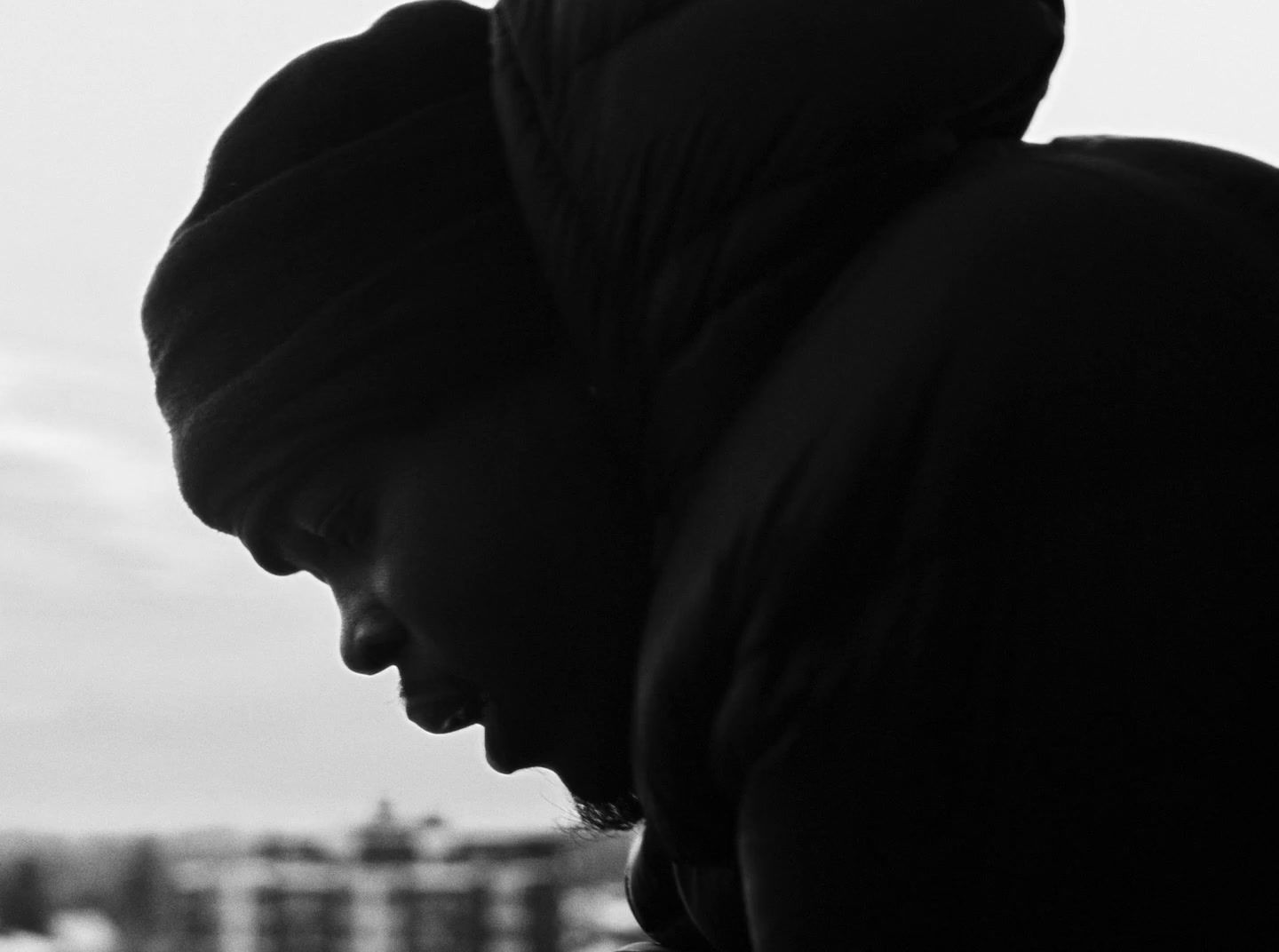 a black and white photo of a man in a turban