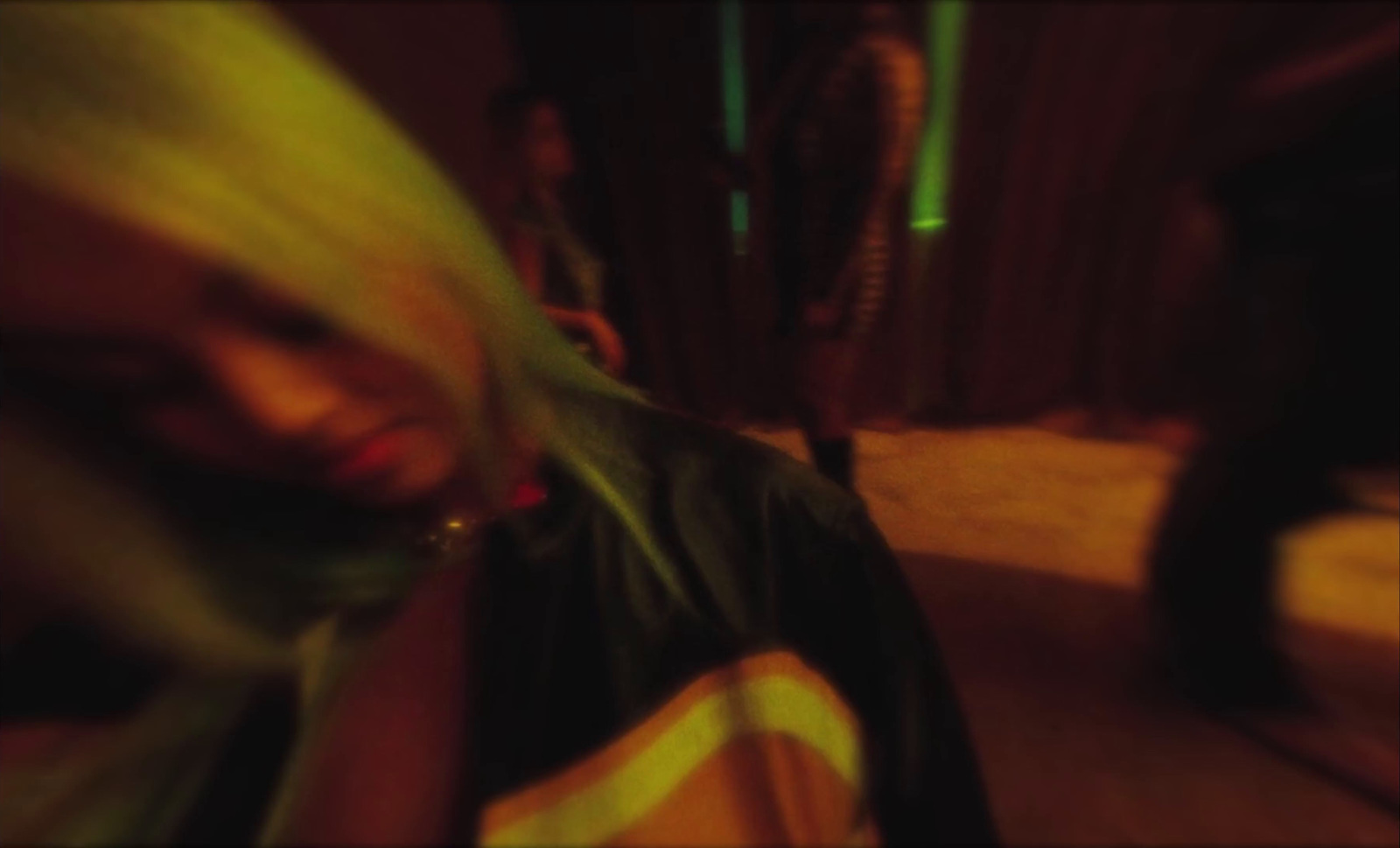 a blurry photo of a woman with blonde hair