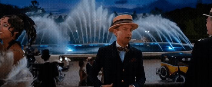 a couple of people that are standing in front of a fountain