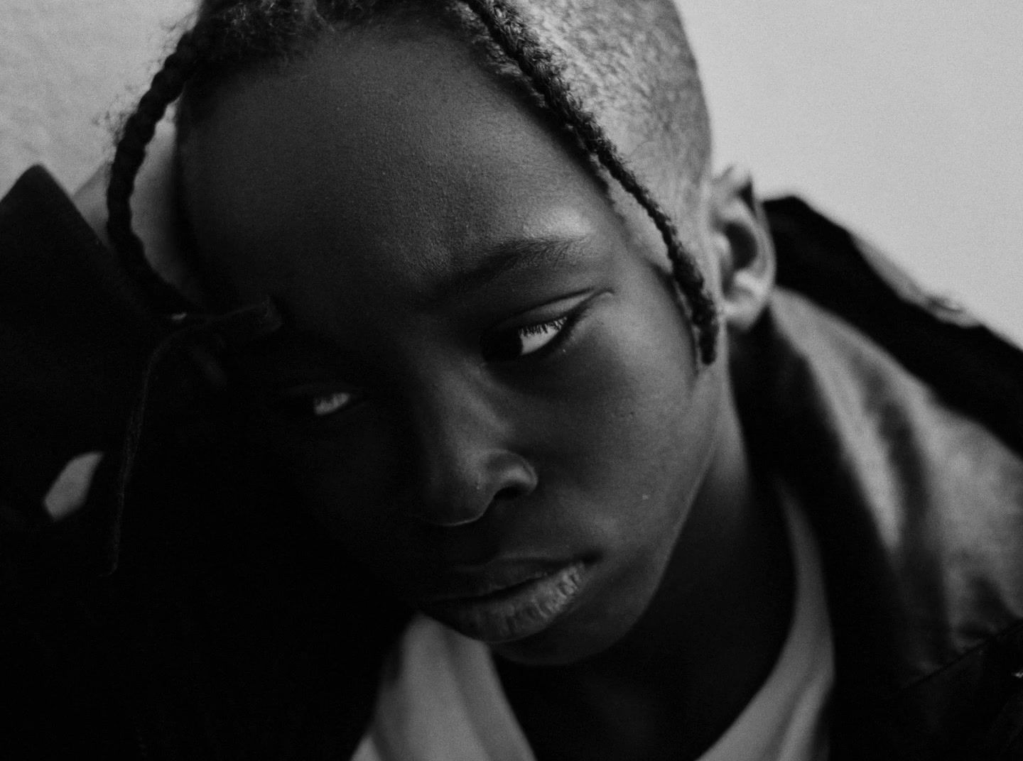 a black and white photo of a young woman