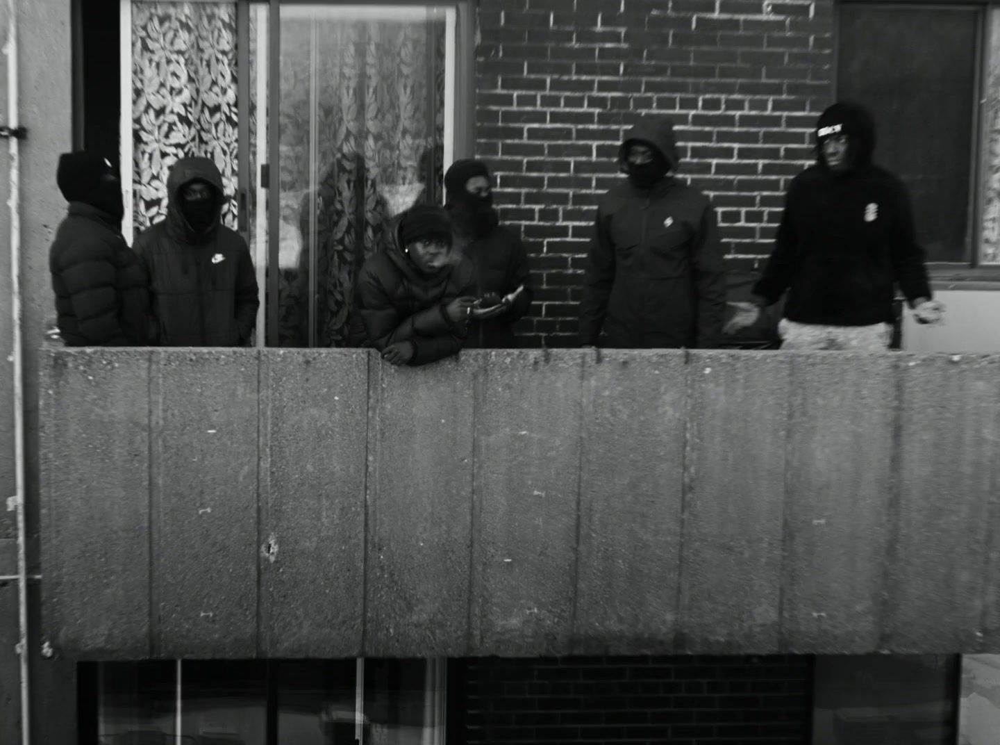 a group of people standing outside of a building