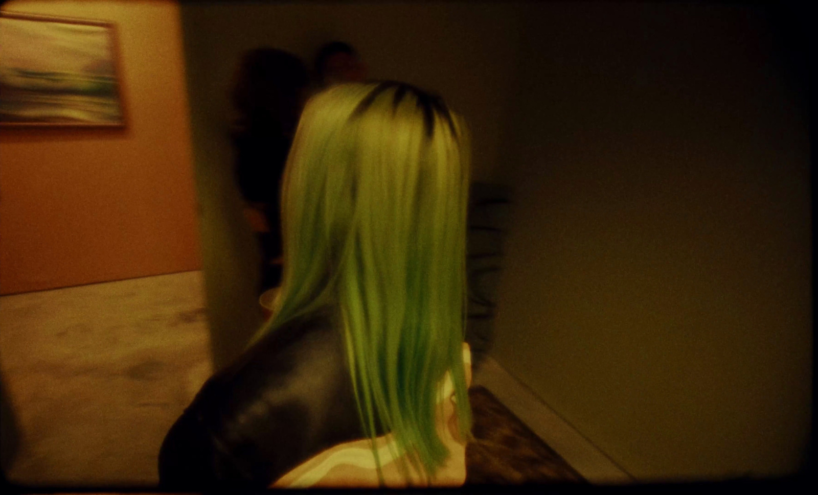 a woman with long green hair in a room