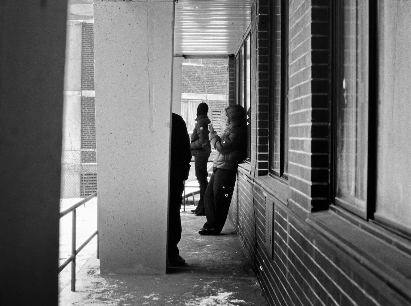 a group of people standing outside of a building