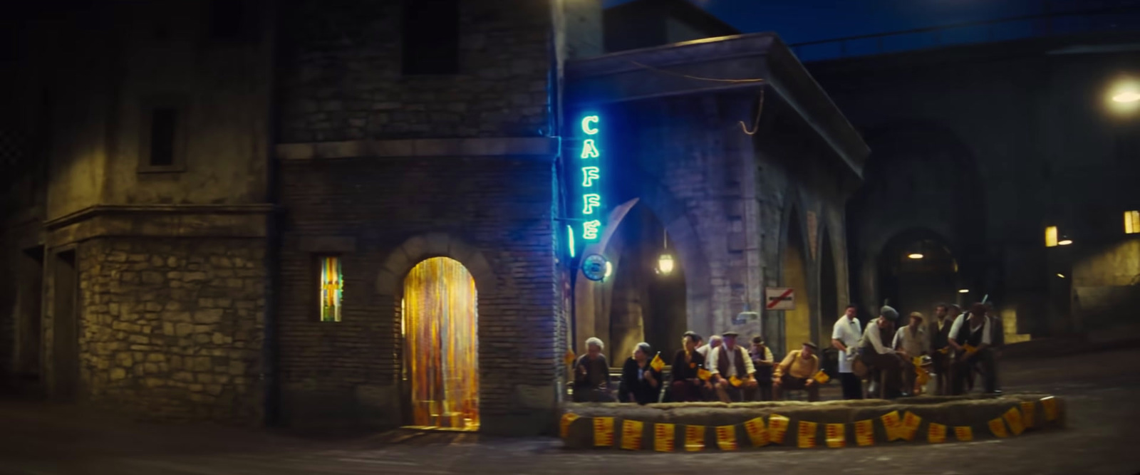 a group of people standing outside of a building