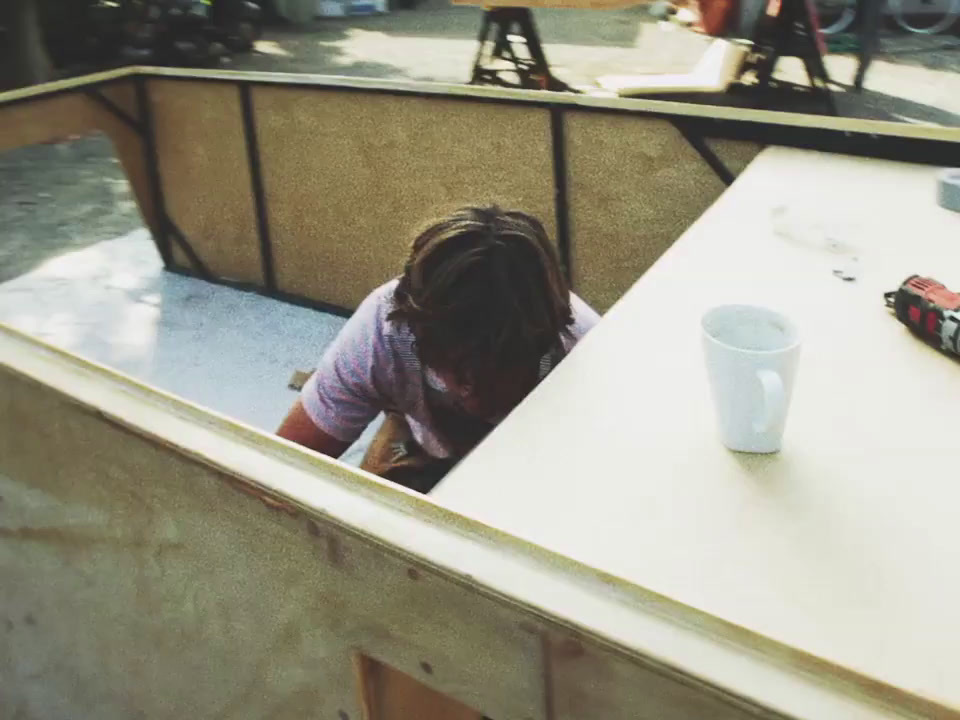 a person sitting at a table with a cup