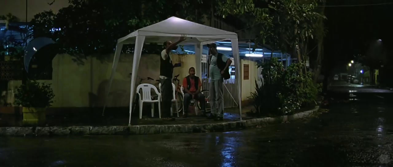 a group of people standing under a white tent