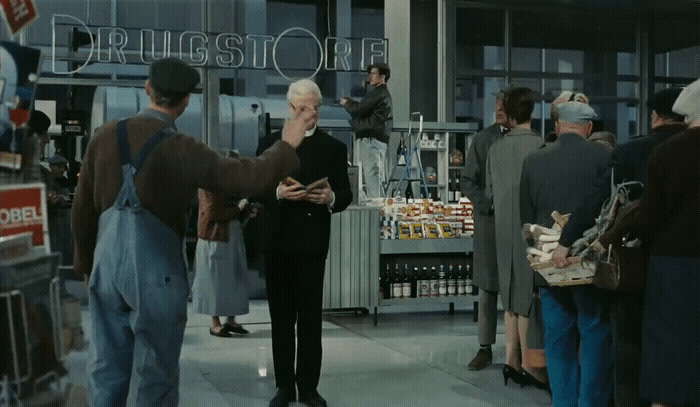 a group of people standing around a store