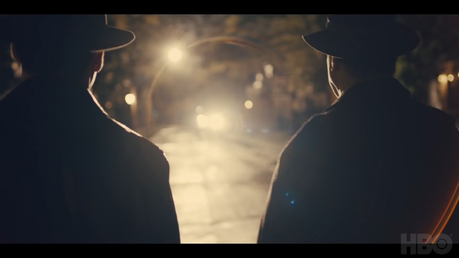 a couple of men standing next to each other