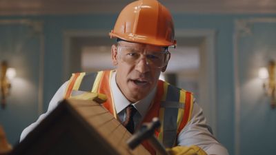 a man wearing a hard hat and safety vest