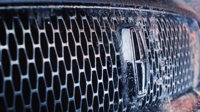 a close up of a grill on a car